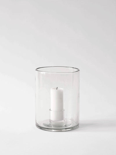 
                    
                      Luna candle holder, medium clear recycled glass, with white pillar candle inside, front view on white.
                    
                  