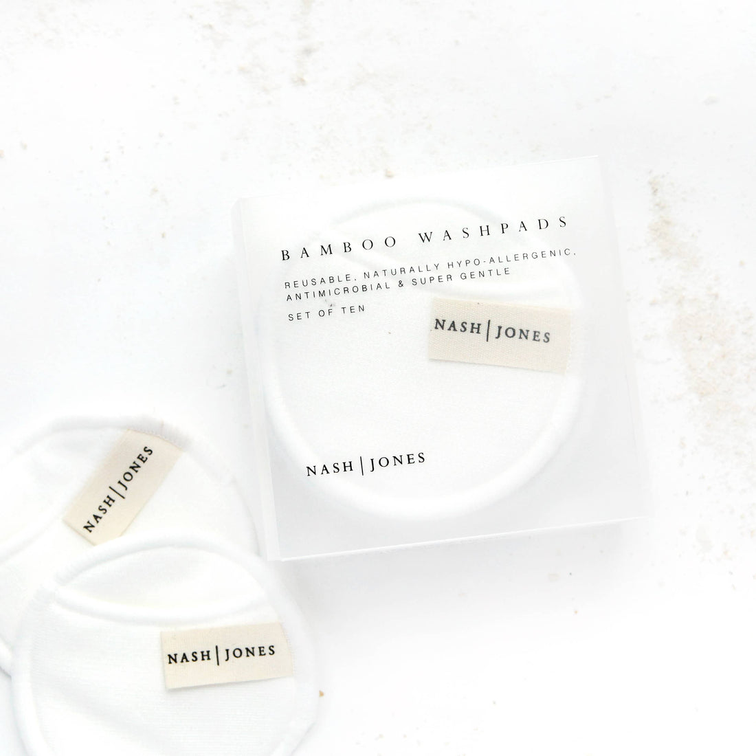 Nash and Jones Bamboo Washpads set, white reusable facial pads in clear packaging, with loose pads displaying brand label.