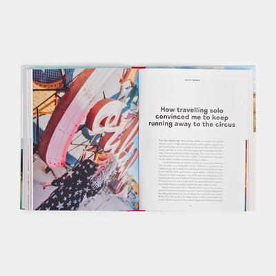 
                    
                      Women Travel Solo book, open to 'How travelling solo...' story with a vibrant photo of a person in a star-patterned shirt…
                    
                  