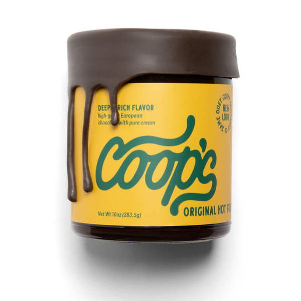 Coop's Original Hot Fudge sauce, 10oz jar with dark brown fudge dripping over yellow label, front on white.