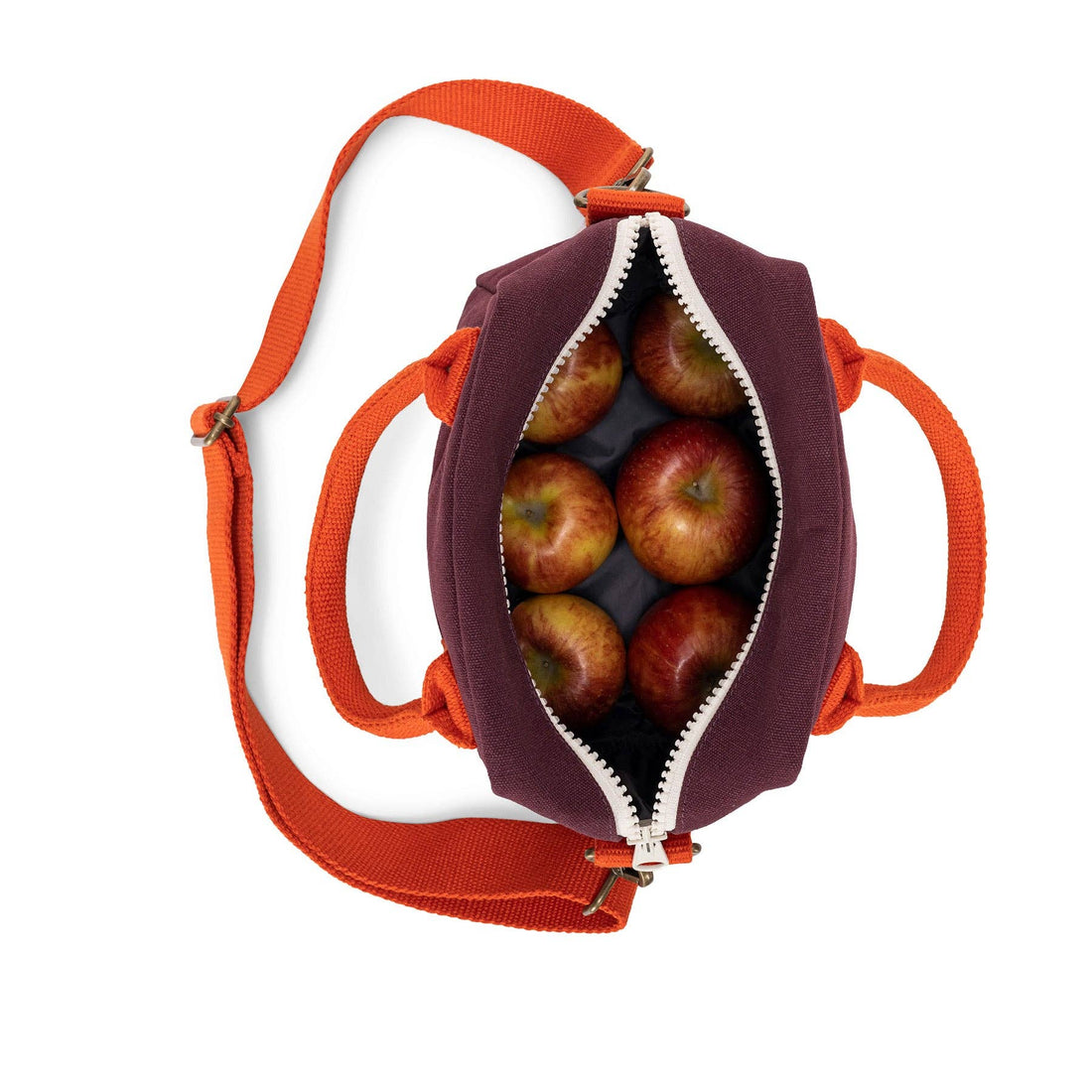 Lunch Clutch Fig lunch bag, open, filled with six red apples, showing capacity. Features fig organic cotton, orange handles,…