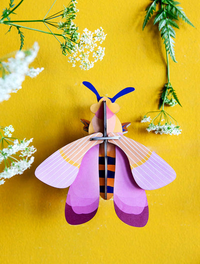 
                    
                      Pink Bee 3D build kit, assembled, showcasing the layered recycled cardboard structure with pink and orange colors.
                    
                  