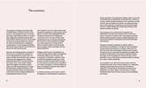 Make a Vision Board book, open spread view of internal light pink pages with black text.