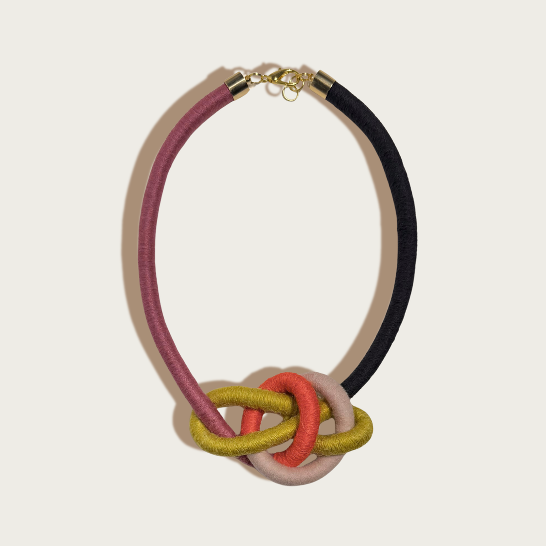 Sasha Water Bowline necklace, yarn-wrapped cording in dark pink, black, olive green, coral, light pink with gold clasp, flat…