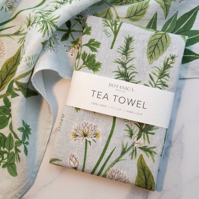 
                    
                      Botanica Paper Co. Herb Garden Linen Tea Towel, light grey organic linen with green botanical pattern, folded packaged…
                    
                  