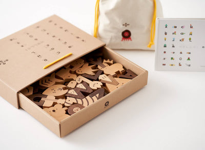 
                    
                      Alphabet Play Blocks wooden blocks. Open kraft box with light beech and dark walnut wood letter and animal shapes.…
                    
                  