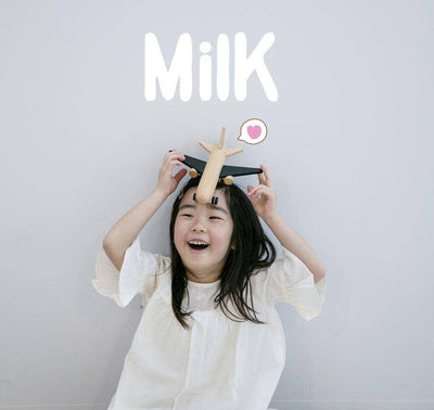 
                    
                      Hikoki Wooden Friction Plane toy, natural beechwood with black wings, held playfully on a smiling child's head for scale.
                    
                  
