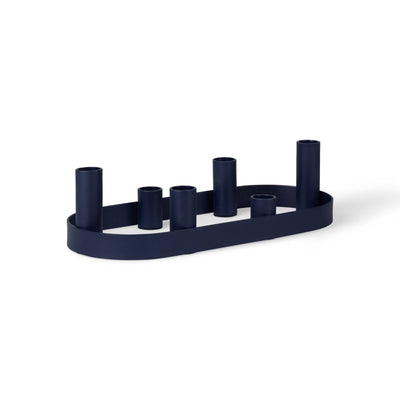 
                    
                      Oval Metal Candelabra, midnight blue painted mild steel, angled side view with staggered candle holder heights on white.
                    
                  