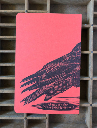 
                    
                      Crow Large Letterpress Notebook, coral red cover with black crow wing illustration and 'for Blackbird Letterpress' text,…
                    
                  