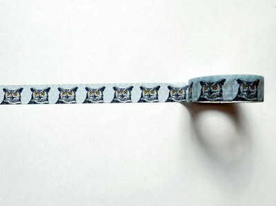 
                    
                      Great Horned Owl washi tape showing repeating black and white owl faces with yellow eyes on light blue, long strip unrolled…
                    
                  
