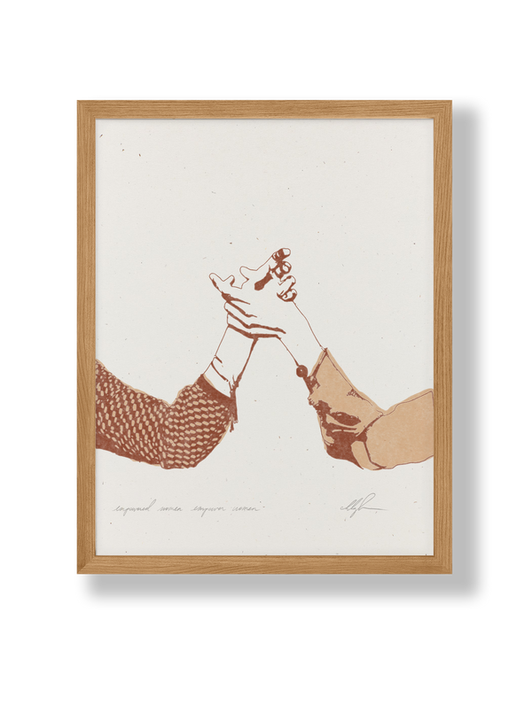 Cocoshalom Empowered Women Empower Women art print, illustration of two sepia hands on flecked recycled paper in light wood…