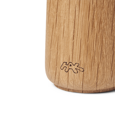 
                    
                      Hammershøi spice grinder, detailed close-up of oiled oak wood grain and etched base logo.
                    
                  