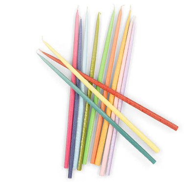 
                    
                      Rainbow Taper Candles, 12 assorted Stearin wax candles, colorful overlapping flat lay arrangement.
                    
                  