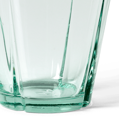 
                    
                      Grand Cru recycled glass tumbler, close-up detail of faceted base and subtle green hue.
                    
                  