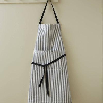 
                    
                      French Striped Cotton Apron, white with thin black vertical stripes, black neck strap and waist ties, full view hanging on a…
                    
                  