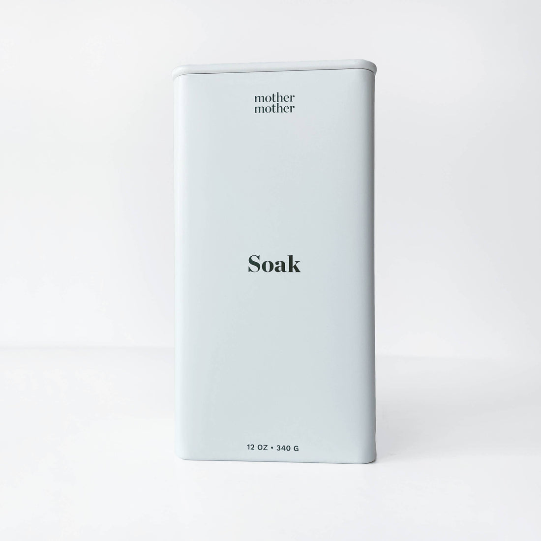 Mother Mother Magnesium Bath Soak, pale grey metal tin with 'Soak' in black lettering, front view on white.