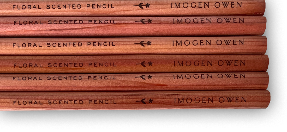 Imogen Owen Rose Geranium Scented Pencils, cedarwood. Close-up of stacked pencils, highlighting engraved 'Floral Scented'…