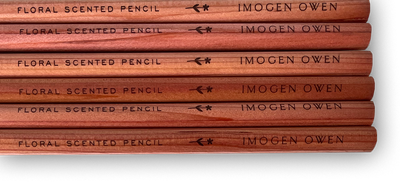 
                    
                      Imogen Owen Rose Geranium Scented Pencils, cedarwood. Close-up of stacked pencils, highlighting engraved 'Floral Scented'…
                    
                  