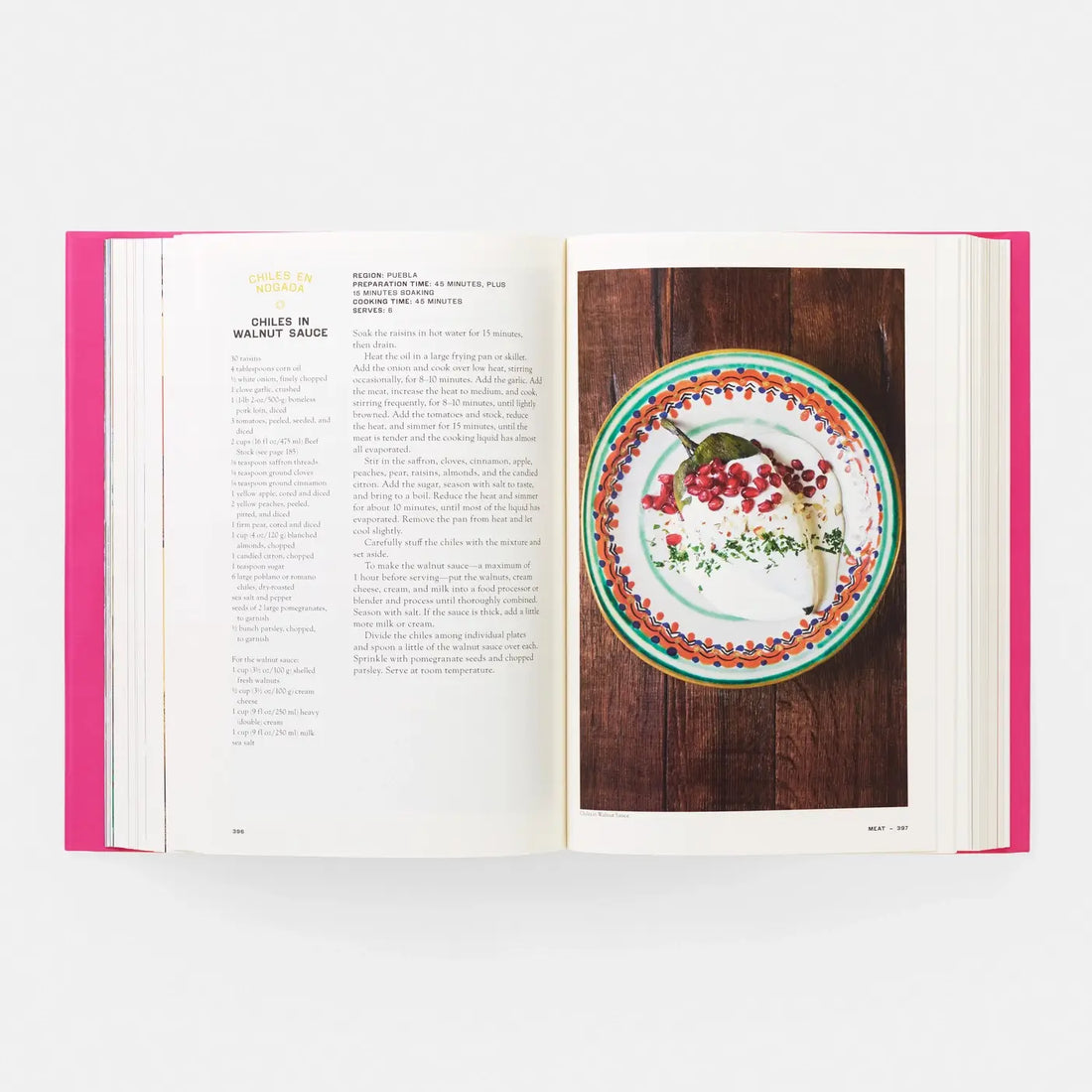 Phaidon Mexico: The Cookbook open spread, colorful Chiles en Nogada food photo and recipe text with pink book edges.