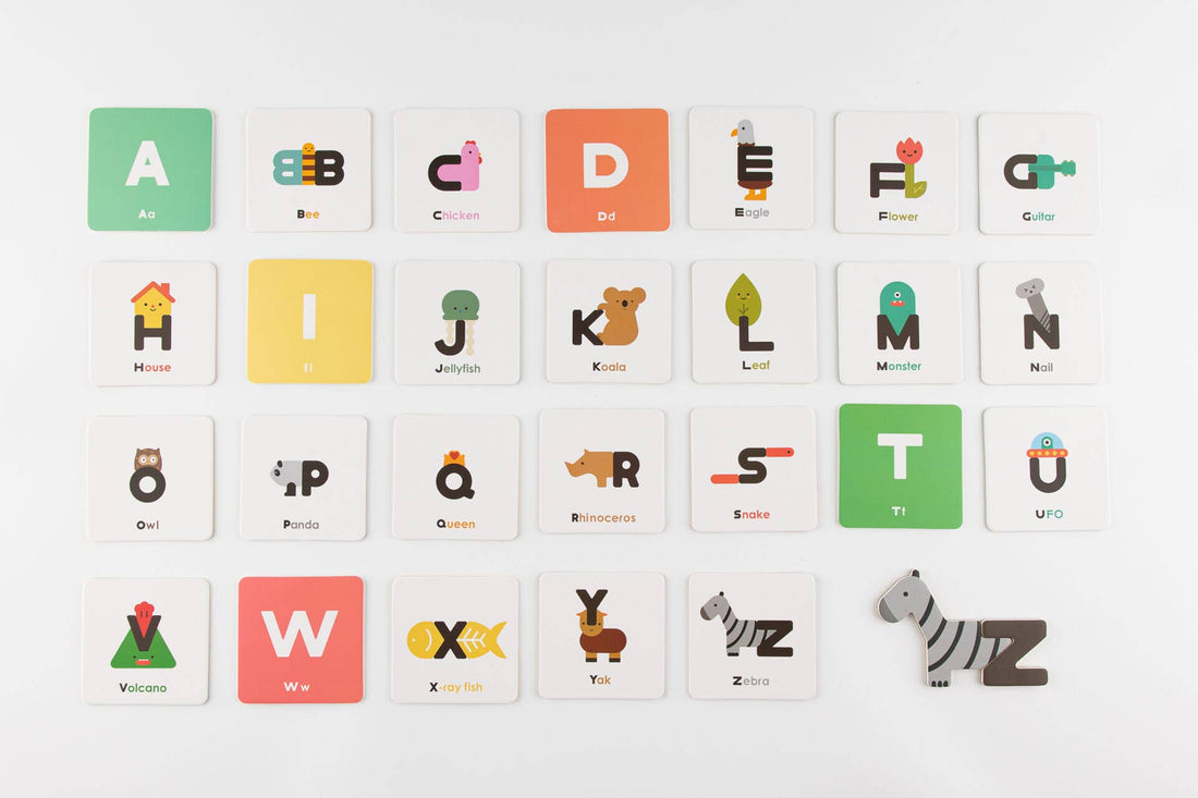 Oioiooi Magnetic Alphabet Play Set, flat lay of 26 colorful magnetic tiles with letters A-Z and animal/object illustrations.