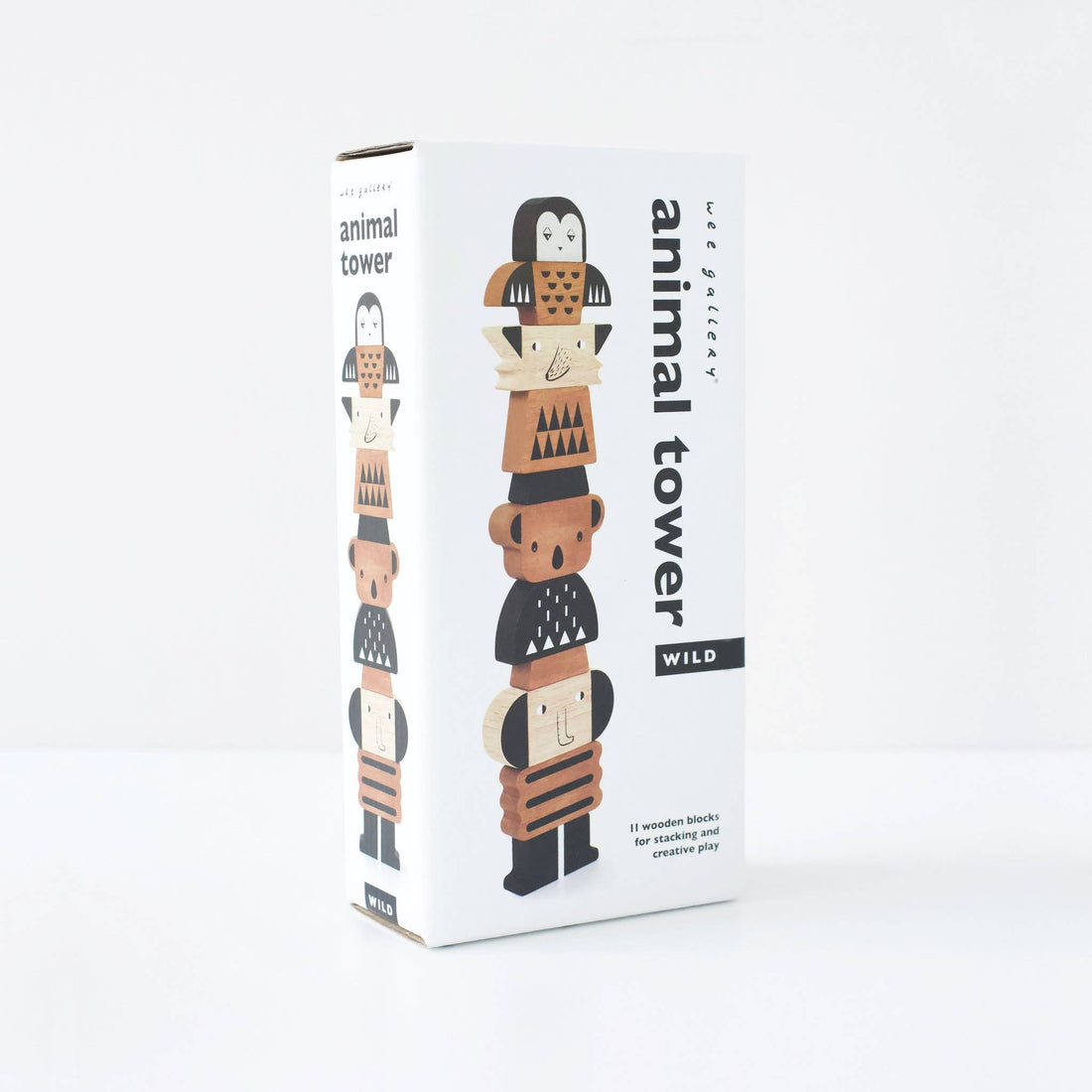 Animal Stacking Tower toy packaging box, natural wood and black animal block illustration, angled view on white.