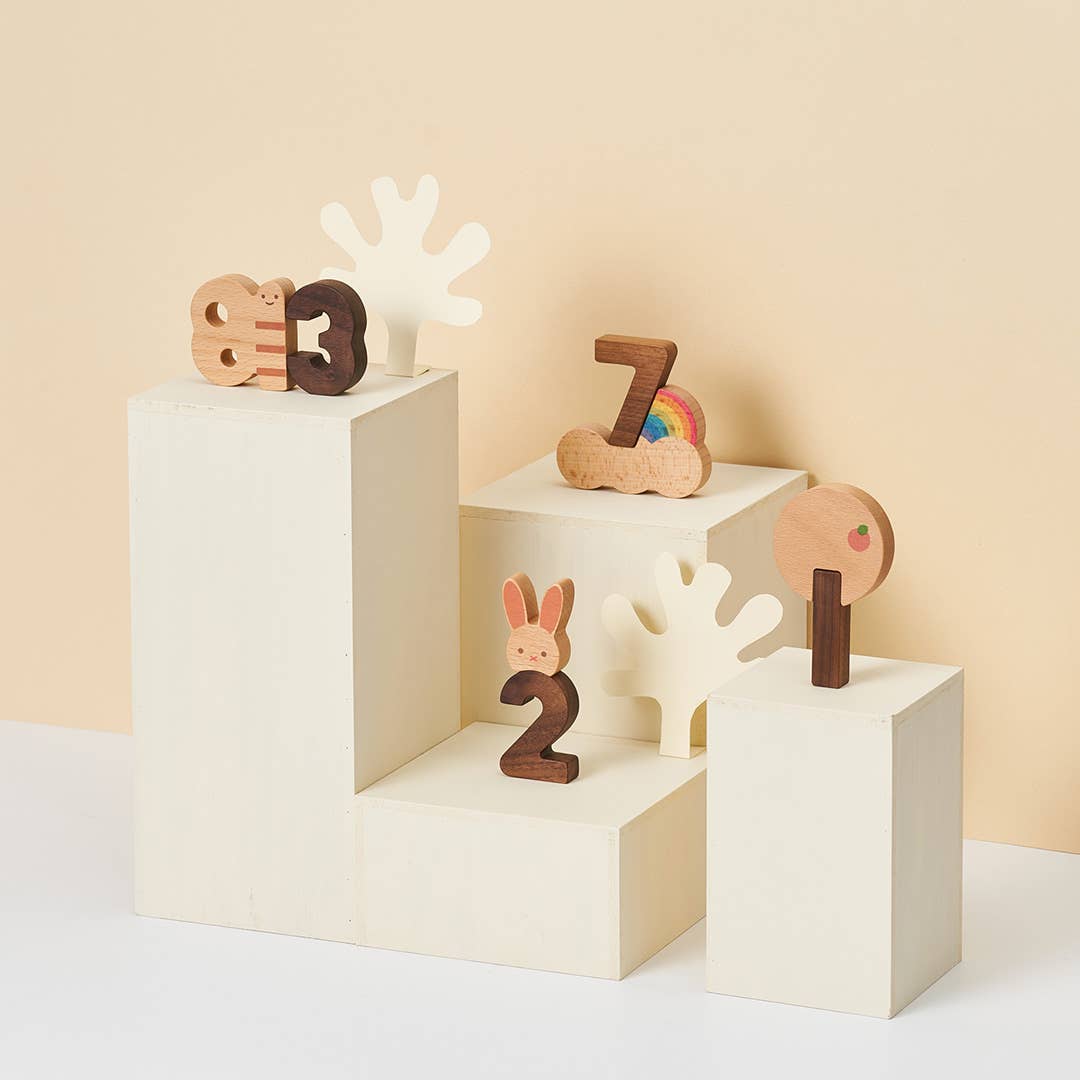 Numbers Play Block Set, solid beech and walnut wood, number and animal blocks displayed at varying heights on risers, side…