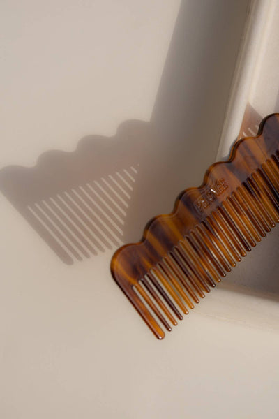 
                    
                      Peignee Paris Signature Wide-Tooth Wave hair Comb, tortoiseshell cellulose acetate, top-down view with wave detail & teeth…
                    
                  