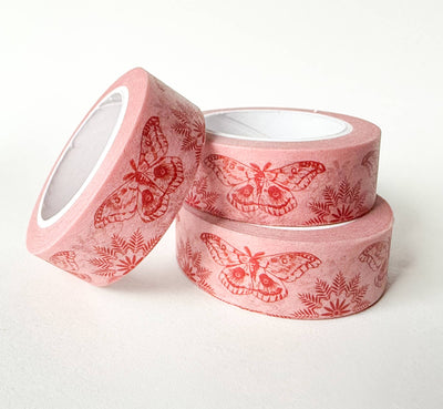 
                    
                      Moths On Pink washi tape, three rolls arranged in a stack, highlighting the red moth and fern print on light pink.
                    
                  
