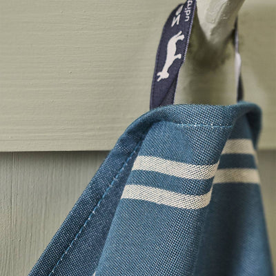 
                    
                      Coeur Vallée tea towel, blue cotton weave with white stripes, close-up detail of hanging loop and fabric.
                    
                  