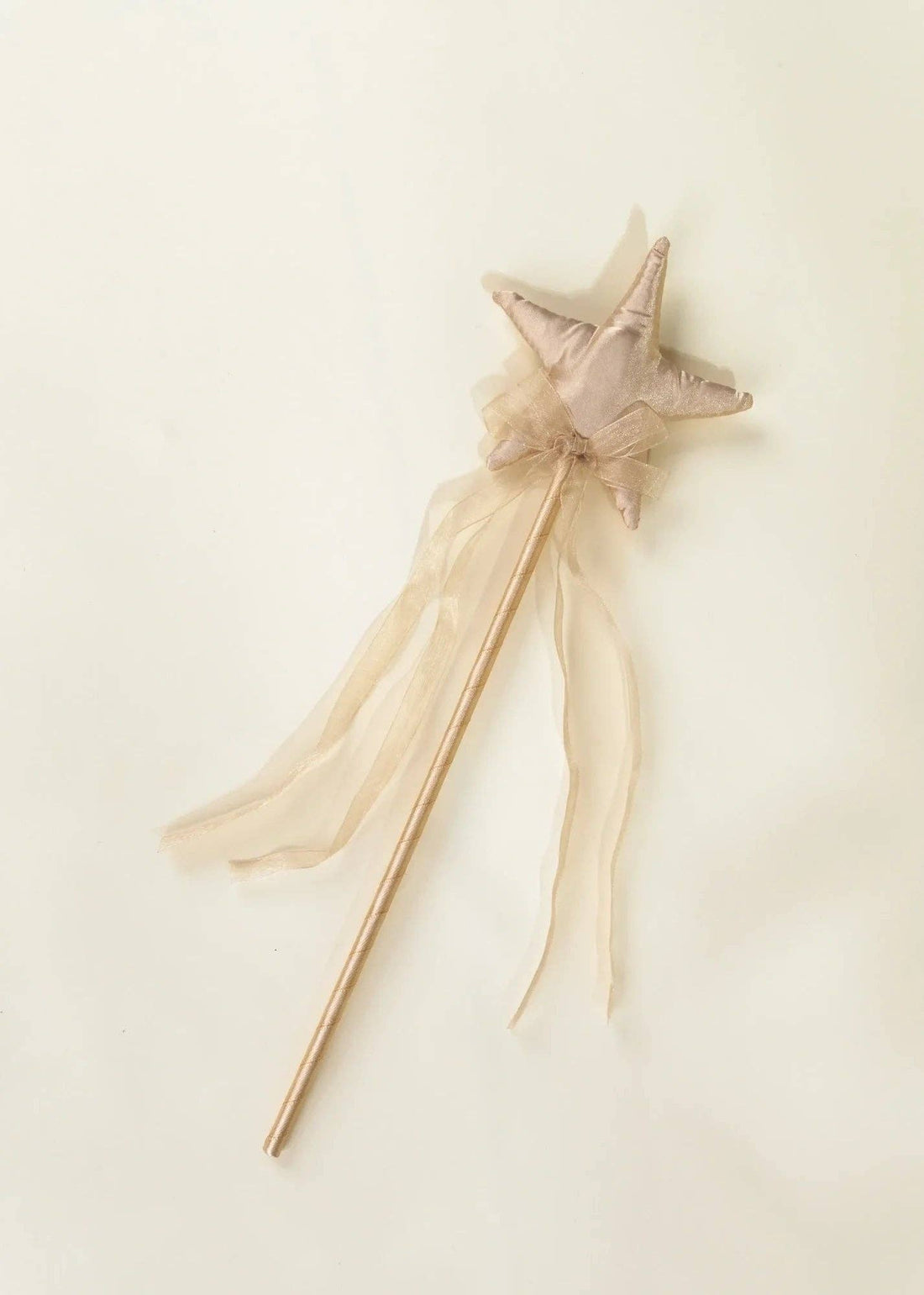 Gold Star play wand featuring a plush gold fabric star, sheer gold ribbon streamers, and a wooden handle, angled flat lay.