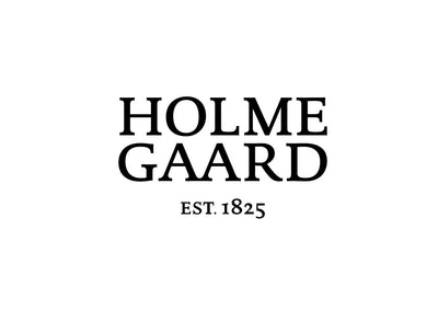 
                    
                      Holme Gaard brand logo, black serif text 'HOLME GAARD EST. 1825' on a clean white background.
                    
                  