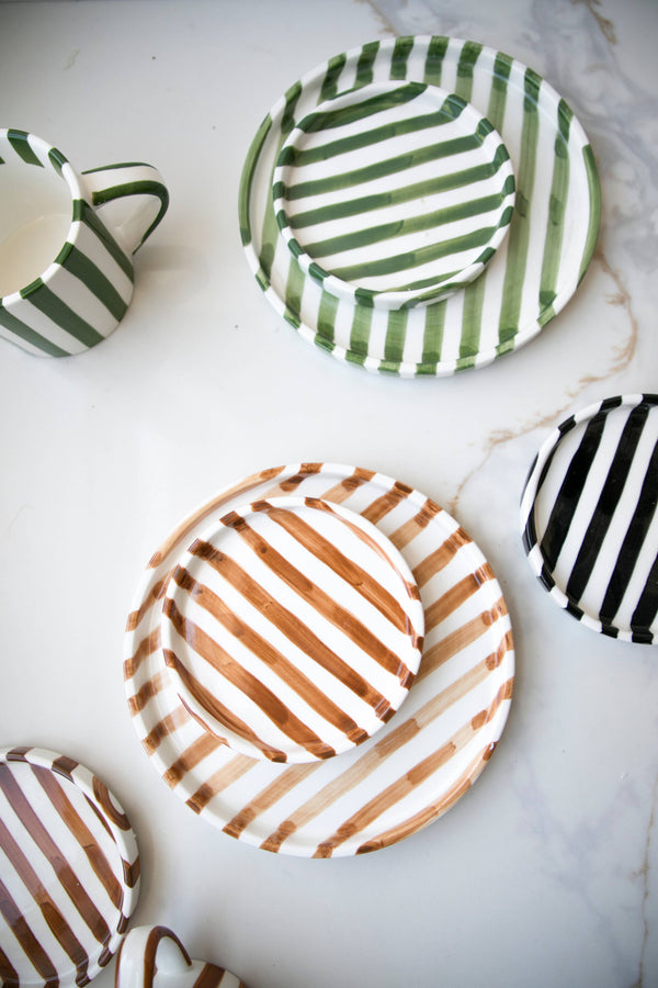 Fodory Striped Ceramic Plates, green, brown, and black striped ceramic, multi-size top-down flat lay.