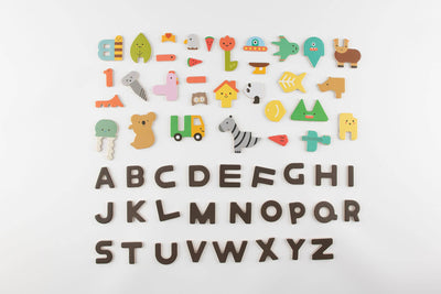 
                    
                      Magnetic Alphabet Play Set, full set of colorful composite shapes and dark brown letters, arranged flat lay on white surface.
                    
                  