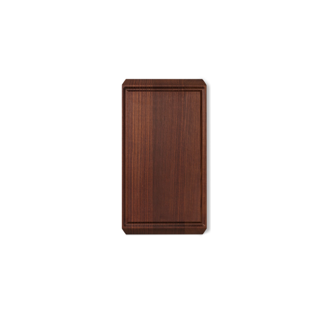 Rå wood cutting board, dark heat-treated ash, angled view emphasizing the rectangular juice groove.