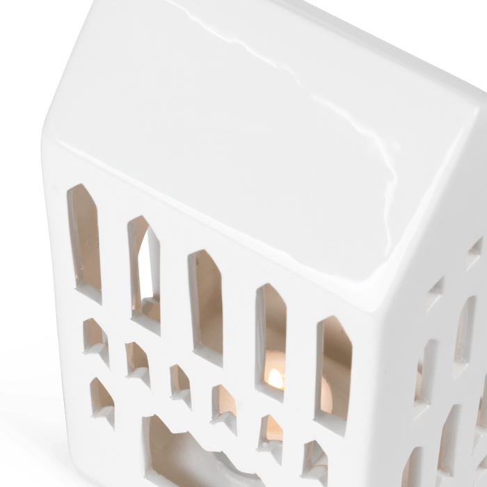 Urbania Ceramic Lighthouse candle holder - Church, white dolomite ceramic, angled close-up showing interior light.