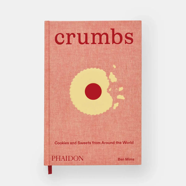 Phaidon Crumbs cookbook, textured reddish-orange hardcover with a partially eaten yellow cookie illustration, front view on…