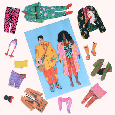 
                    
                      Fearless Fashion magnetic doll set, full flat lay of two diverse paper dolls and a wide array of bold, patterned magnetic…
                    
                  