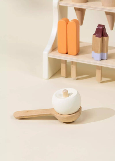 
                    
                      Wooden Ice Cream Stand play food set, white ice cream scoop on wood spoon, orange popsicles on display.
                    
                  