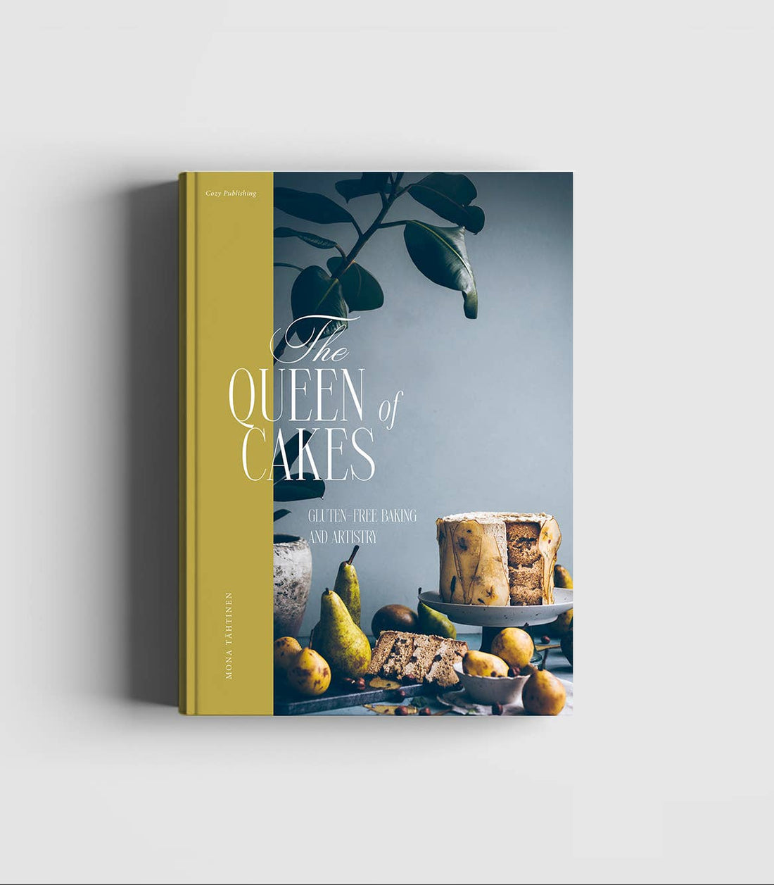 Cozy Publishing Queen of the Cakes book, yellow spine, cover with cake & pears, 'GF Baking & Artistry', front view.