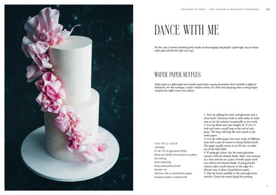 
                    
                      Queen of the Cakes Gluten-free baking book, open page with 'Wafer Paper Ruffles' recipe, showing two-tier white cake with…
                    
                  