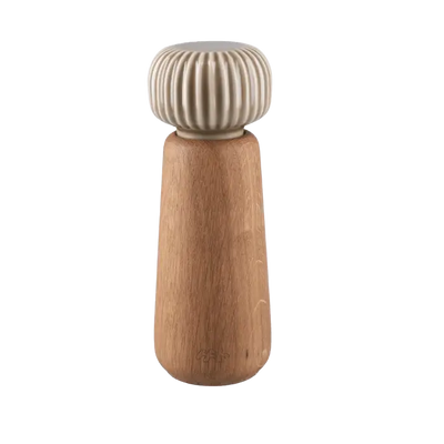 
                    
                      Danish Design Collective Hammershøi spice grinder, oiled oak base with ribbed porcelain top, front on white.
                    
                  
