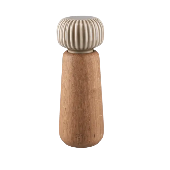 Danish Design Collective Hammershøi spice grinder, oiled oak base with ribbed porcelain top, front on white.