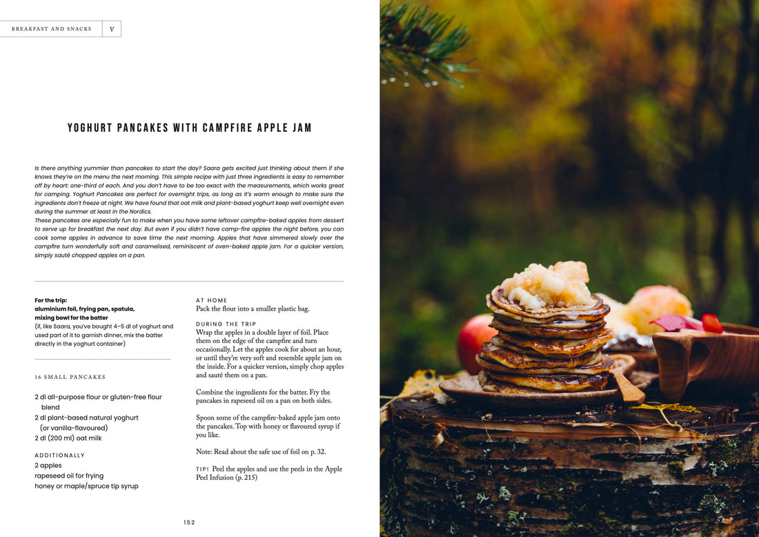 Food Over the Campfire print book, open to 'Yoghurt Pancakes with Campfire Apple Jam' recipe and outdoor photo.