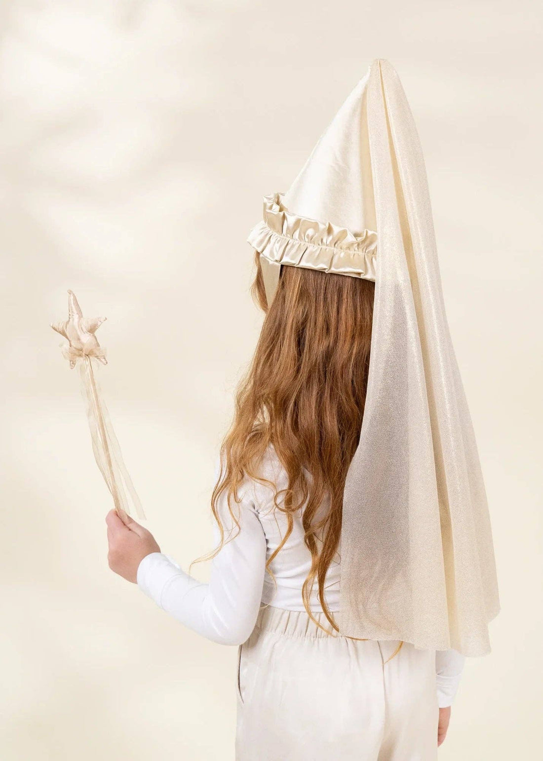 Gold Star play wand with shimmery gold fabric star and sheer ribbon, held by a child from behind for scale.