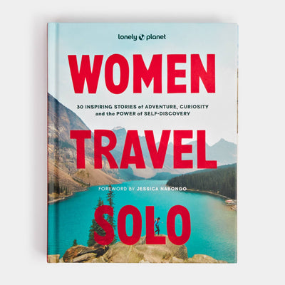 
                    
                      Lonely Planet Women Travel Solo book, light blue mountain lake cover with red text, front view on white.
                    
                  