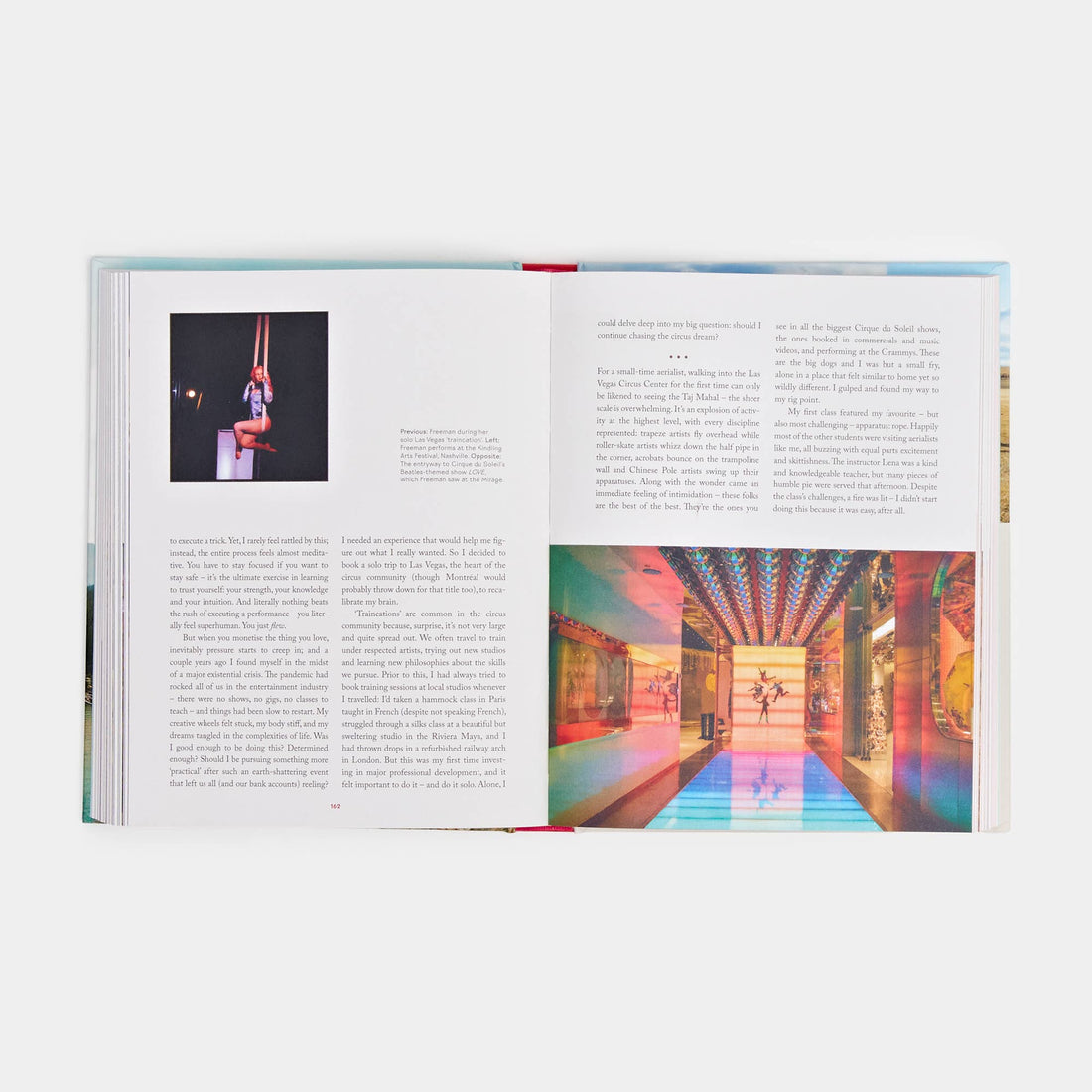 Women Travel Solo book, open pages displaying two vibrant color photos: a circus aerialist on silks and a modern hall with…