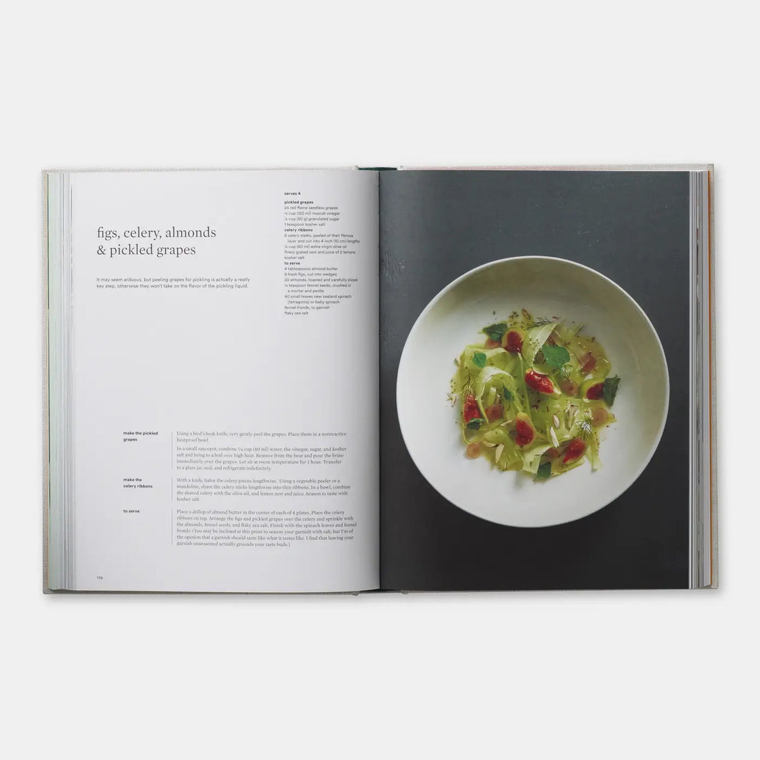 On Vegetables cookbook open to 'figs, celery, almonds & pickled grapes' recipe, with a photo of the vibrant green and red…