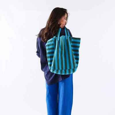 
                    
                      Elisabeth Tote Bag, Stripes Turquoise / Olive cotton, carried on model's shoulder, back view showing full size.
                    
                  
