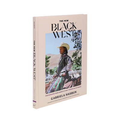 
                    
                      The New Black West book, angled view, showing beige cover with a Black cowgirl in white hat on horseback, and full spine.
                    
                  