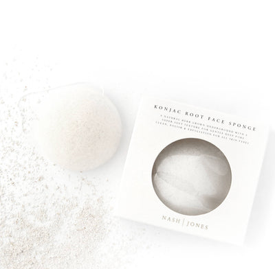 
                    
                      Nash and Jones Konjac Face Exfoliation Sponge, natural off-white Konjac material, next to white branded box, flat lay.
                    
                  